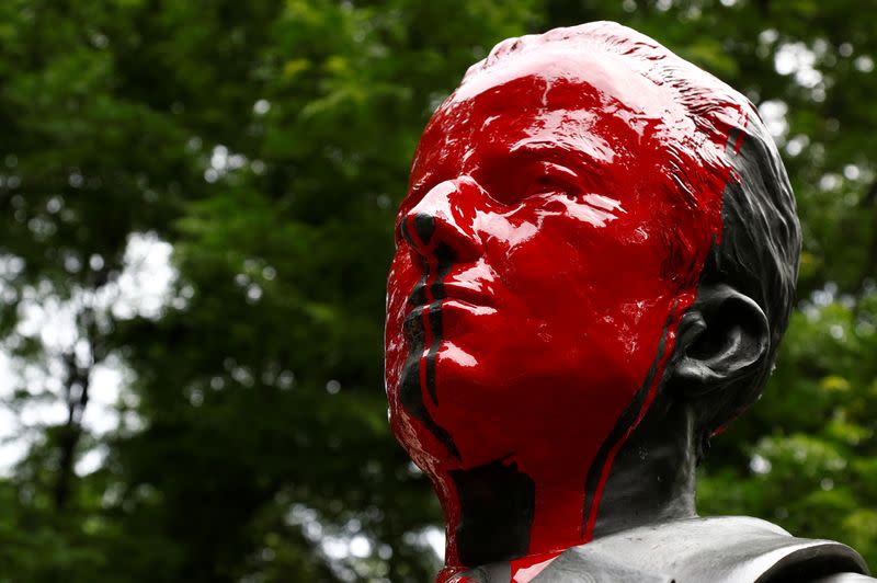 Statue of former Belgian King Baudouin is seen covered in red paint in Brussels