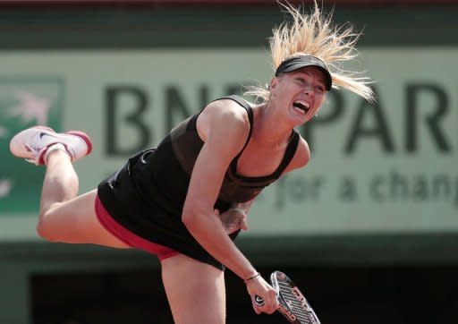 Russia's Maria Sharapova serves to China's Peng Shuai during their French Open match at the Roland Garros stadium in Paris. Sharapova won 6-2, 6-1