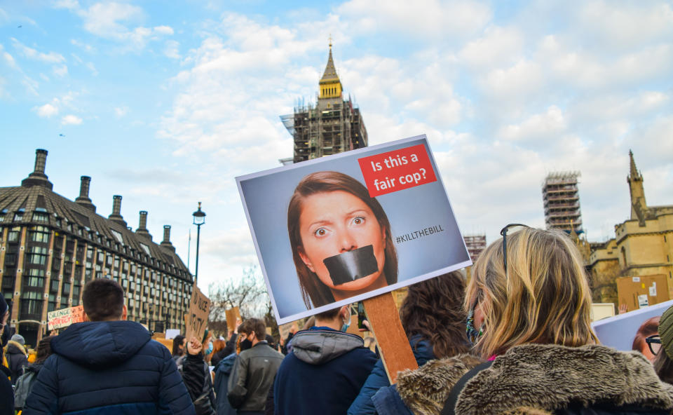 A protester holds a placard during the demonstration.