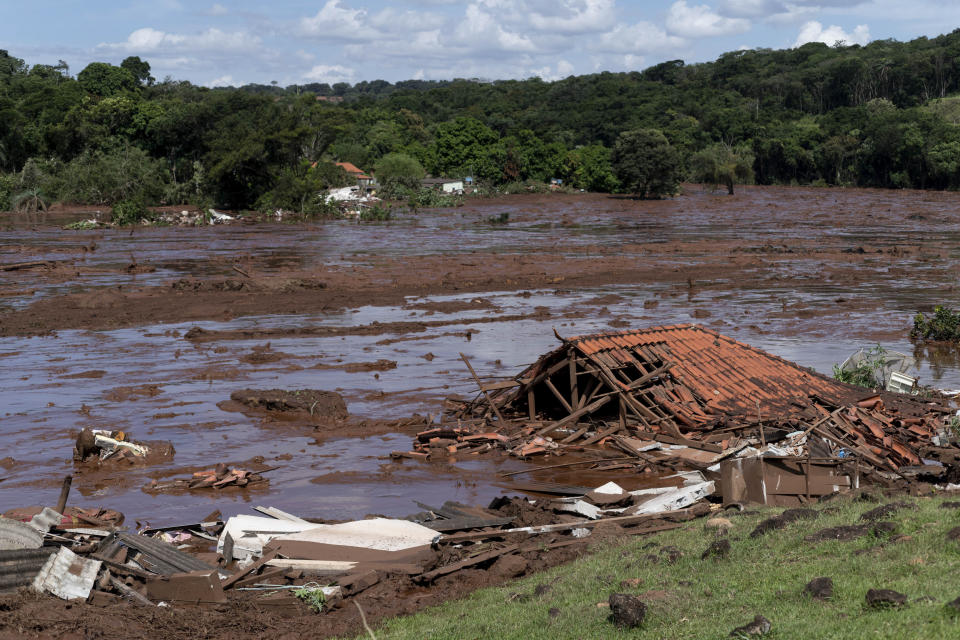 FILE - In this Jan. 25, 2019 file photo, a structure lays in ruins after a dam collapsed near Brumadinho, Brazil. The wave of mud and debris that on Jan. 25, 2019 buried the equivalent of 300 soccer pitches and killed 270 people, continues to barrel over residents’ minds, the local economy and the environment, one year later. (Leo Drumond/Nitro via AP, File)