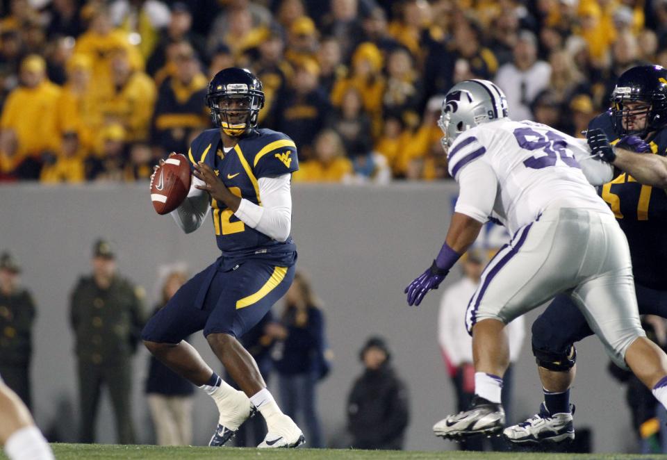 Geno Smith #12 of the West Virginia Mountaineers drops back to pass against the Kansas State Wildcats during the game on October 20, 2012 at Mountaineer Field in Morgantown, West Virginia. (Photo by Justin K. Aller/Getty Images)