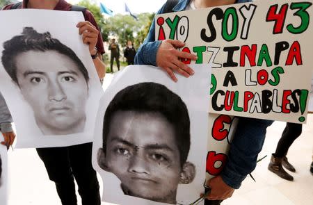 Students take part in a protest in support of the 43 missing students of the Ayotzinapa teachers' training college Raul Isidro Burgos, outside the Mexican Embassy in Bogota November 7, 2014. REUTERS/John Vizcaino