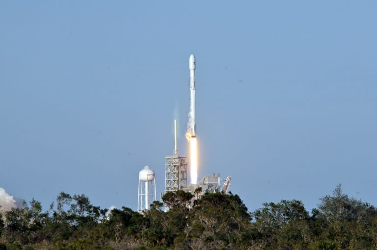 Space X's recycled Falcon 9 rocket lifts off from Kennedy Space Center, cheered by experts as a "historic" moment as companies scramble to lower space travel costs