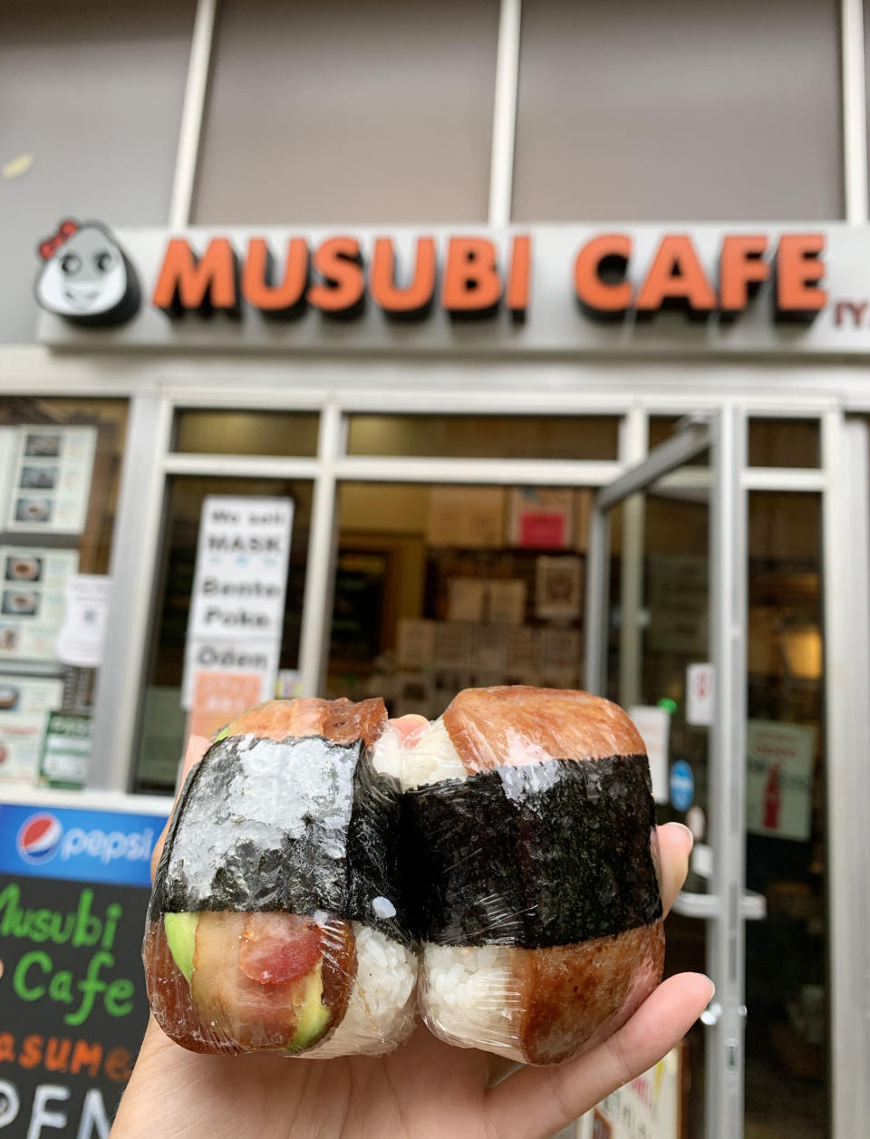 Several different kinds of Spam musubi can be found at Musubi Cafe IYASUME, in any of its five Honolulu locations. I got Original Teriyaki Spam and Avocado Bacon Spam, pictured here.  (Elyse Pham)