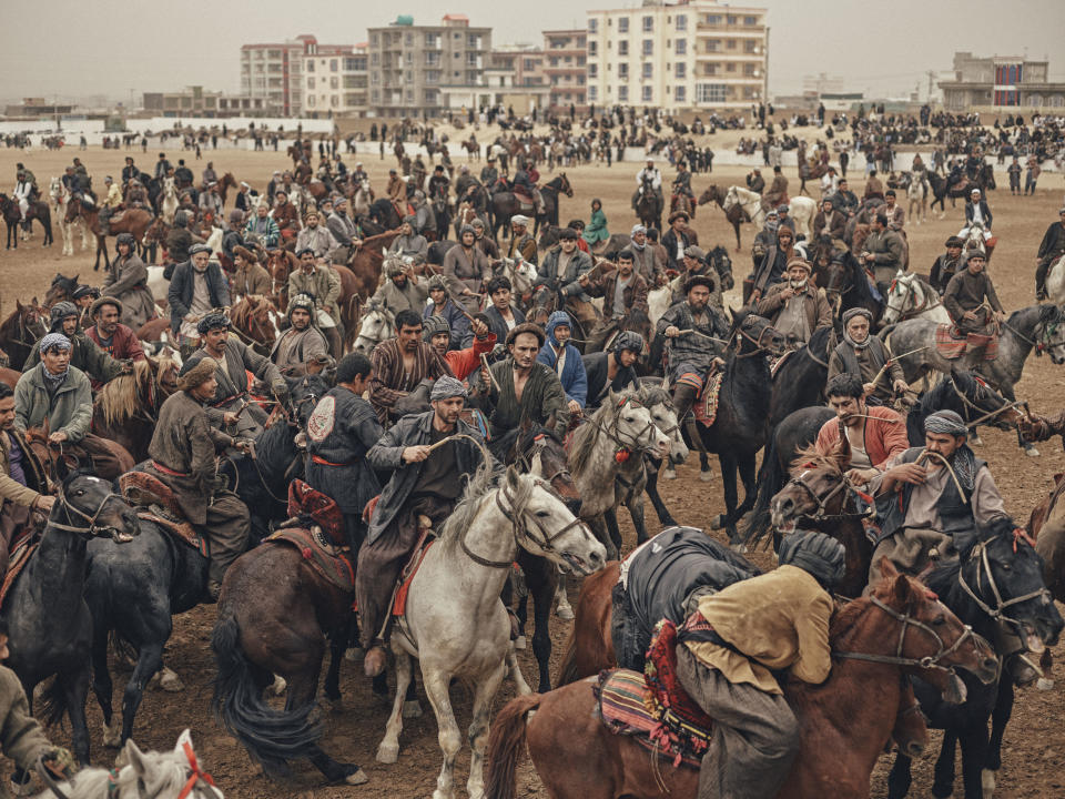 Horsemen fight for a headless calf carcass during a buzkashi match on the day of Nawroz, or Persian New Year, in Mazar-e Sharif, Afghanistan, on March 21, 2017.