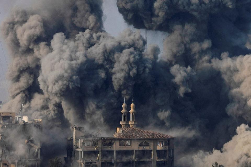 FILE PHOTO: Smoke billows following Israeli strikes on the Islamic University of Gaza (IUG), amid the ongoing conflict between Israel and Hamas, in Gaza City, October 11, 2023. REUTERS/Saleh Salem/File Photo