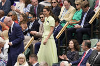 Kate, Princess of Wales smiles as she arrives in the Royal Box with AELTC chairman Ian Hewitt ahead of the final of the women's singles between the Czech Republic's Marketa Vondrousova and Tunisia's Ons Jabeur on day thirteen of the Wimbledon tennis championships in London, Saturday, July 15, 2023. (AP Photo/Kirsty Wigglesworth)