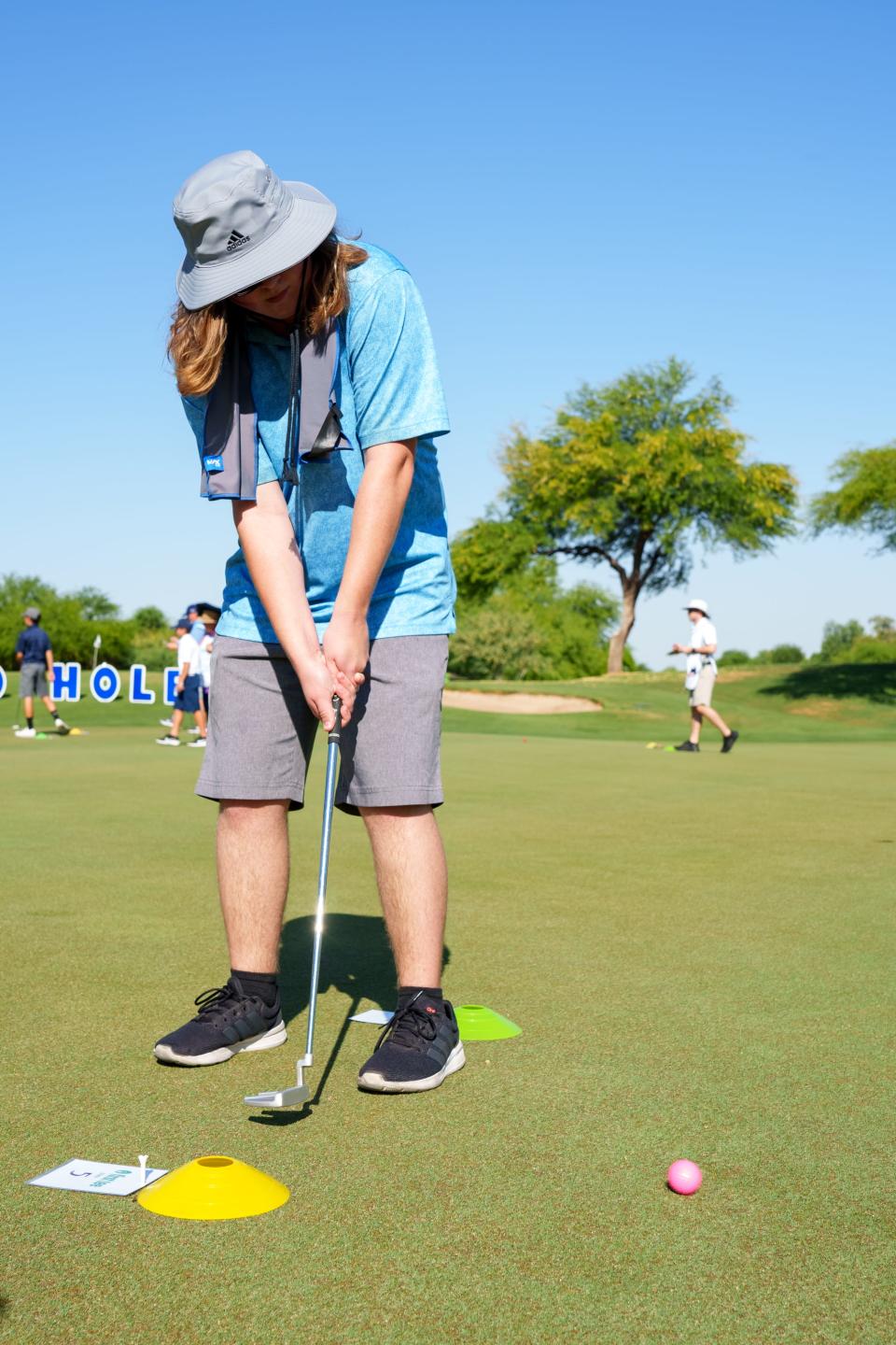 Shane Ishmael, 17, putts at First Tee Phoenix's 100-hole Putt-a-Thon at Legacy Golf Resort on June 11, 2022, in Phoenix, AZ.