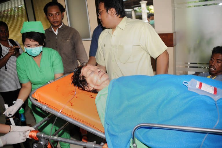 A passenger from the Lion Air plane that landed in the sea arrives at Kedongan Hospital on Bali on April 13, 2013