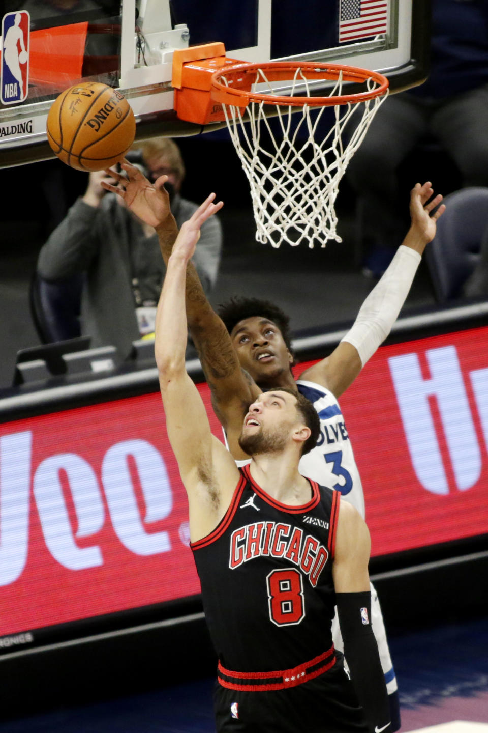 Minnesota Timberwolves forward Jaden McDaniels (3) blocks a shot by Chicago Bulls guard Zach LaVine (8) in the first quarter of an NBA basketball game, Sunday, April 11, 2021, in Minneapolis. (AP Photo/Andy Clayton-King)