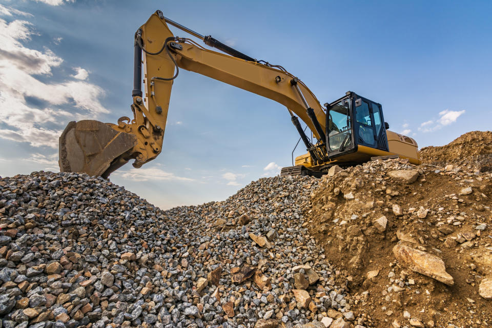 Excavator digging gravel