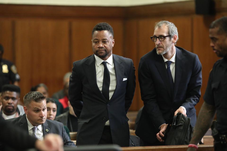Cuba Gooding Jr., center, appears in court to face new sexual misconduct charges, Tuesday, Oct. 15, 2019, in New York. The new charges involve an alleged incident in October 2018. Gooding Jr. pleaded not guilty. The defense paints it as a shakedown attempt. (Alec Tabak/New York Daily News Pool via AP)