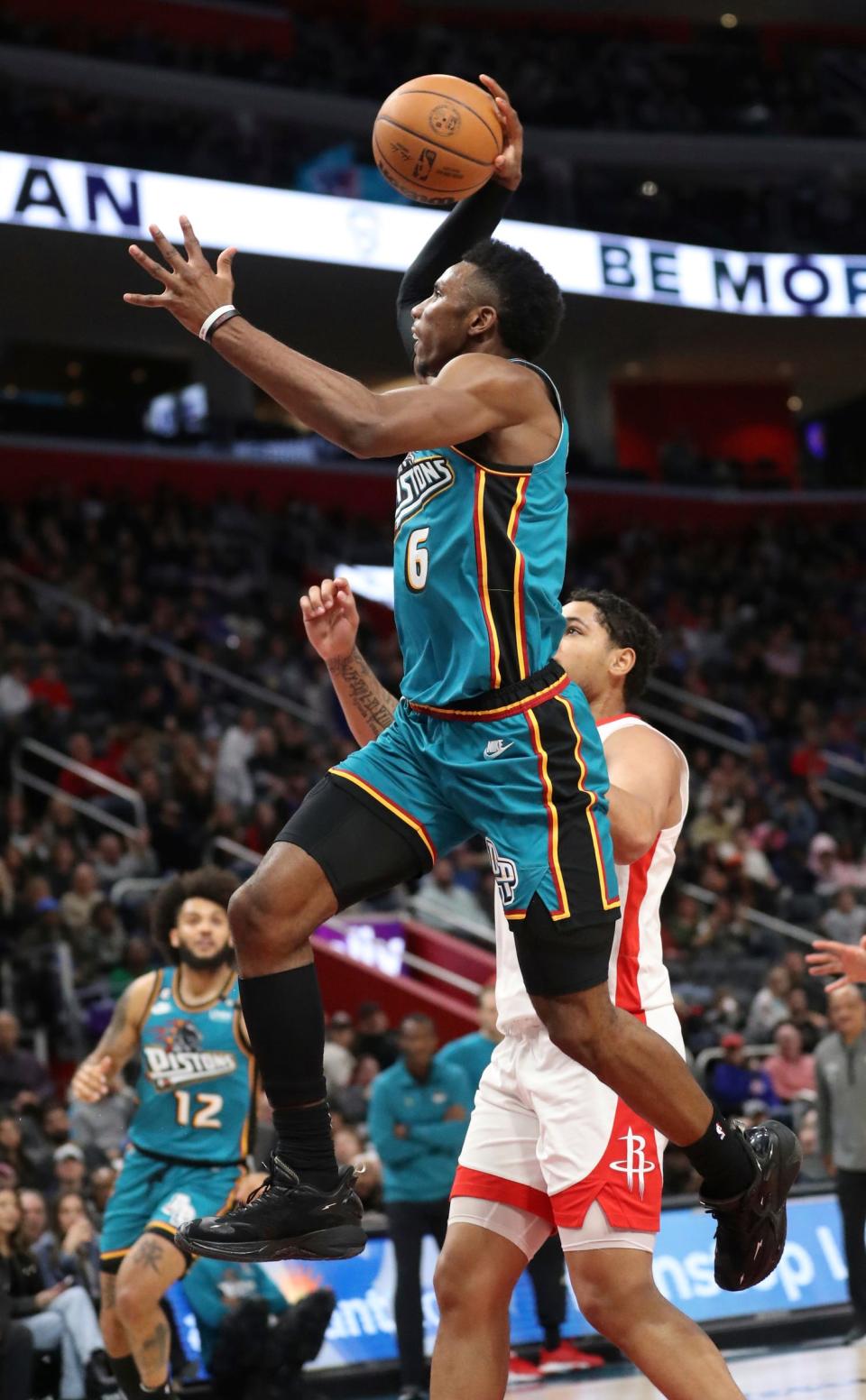 Detroit Pistons guard Hamidou Diallo (6) scores against Houston Rockets guard Daishen Nix (15) during second-quarter action at Little Caesars Arena in Detroit on Saturday, Jan. 28, 2023.