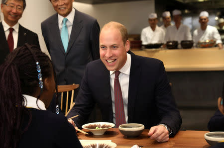 Britain's Prince William joins local school children from St Cuthbert with St Matthias CE Primary School at a copper beating workshop during the official opening of Japan House in London, Britain, September 13, 2018. Tim P. Whitby/Pool via REUTERS