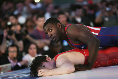 U.S. wrestler James Green (top) pins with Japanese wrestler Nobuyoshi Takojima at the "Beat The Streets" wrestling event in Times Square, New York City, U.S., May 17, 2017. REUTERS/Joe Penney