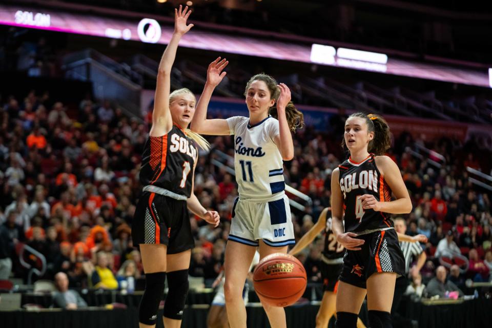 Des Moines Christian's Addy Oetker (11) had to deal with a very good Solon defense all afternoon in the state semifinals.