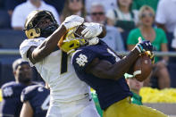 Purdue cornerback Jamari Brown (7) breaks up a pass to Notre Dame wide receiver Kevin Austin Jr. (4) during the second half of an NCAA college football game in South Bend, Ind., Saturday, Sept. 18, 2021. Notre Dame defeated Purdue 27-13. (AP Photo/Michael Conroy)