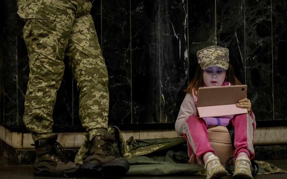 People shelter inside a subway station during an air raid alert, amid Russia's attack on Ukraine, in Kyiv, Ukraine May 4, 2023 - Alina Smutko/REUTERS