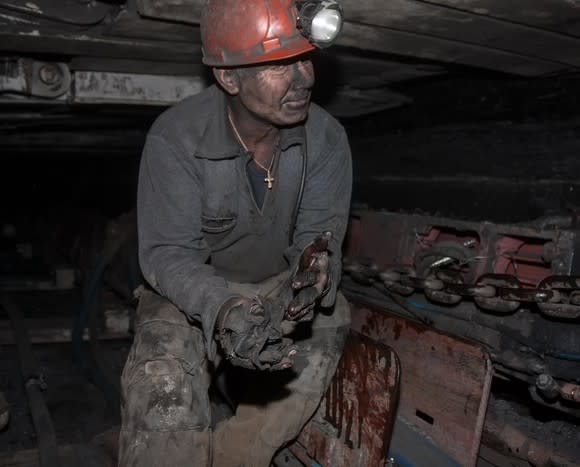 A coal miner working in a mine