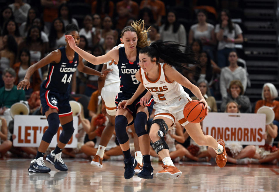 Texas guard Shaylee Gonzalez drives past UConn guard Paige Bueckers during their game Sunday in Austin, Texas. (Photo by John Rivera/Icon Sportswire via Getty Images)