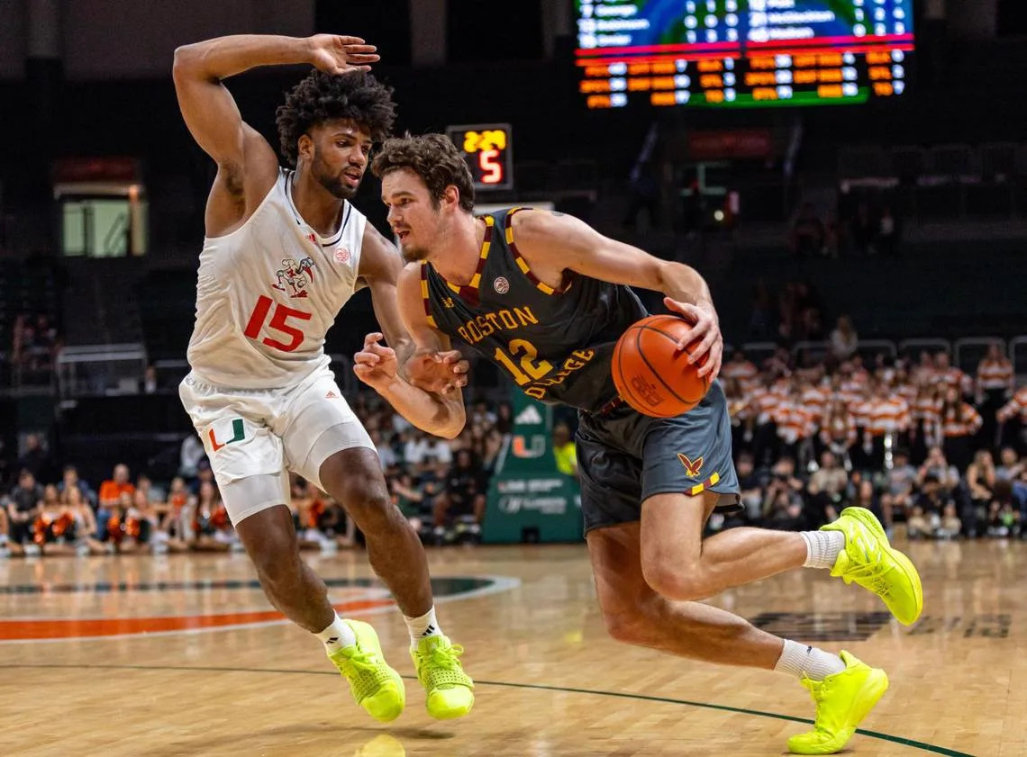 Hurricanes forward Norchad Omier (15) defends the drive by Boston College Eagles forward Quinten Post (12) during the first half of an NCAA basketball game at Watsco Center in Coral Gables, Florida on Wednesday, March 6, 2024. D.A. Varela/dvarela@miamiherald.com