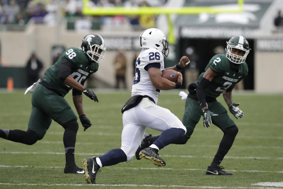 Penn State running back Saquon Barkley didn’t have much room to work with during the first half against Michigan State, but had an impressive performance in the locker room during a weather delay. (AP Photo)