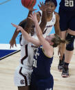 Georgia Tech guard Lotta-Maj Lahtinen (31) shoots against South Carolina forward Laeticia Amihere, left, during the first half of a college basketball game in the Sweet Sixteen round of the women's NCAA tournament at the Alamodome in San Antonio, Sunday, March 28, 2021. (AP Photo/Eric Gay)