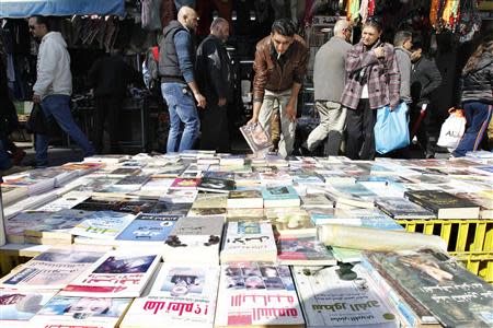 Books are displayed on a pavement in downtown Amman in this January 21, 2014 file photo. REUTERS/Muhammmad Hamed/Files