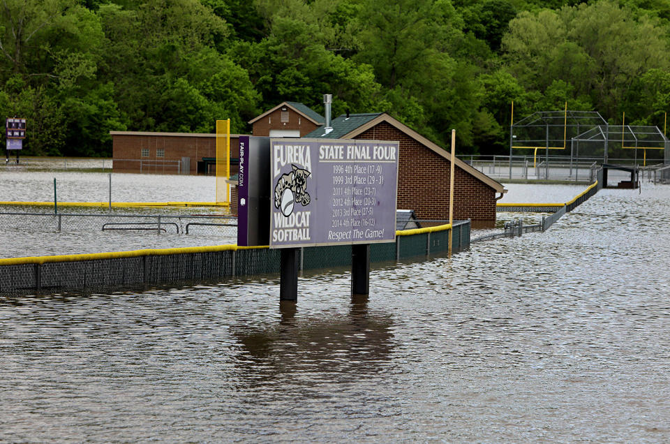 Floodwaters covering high school athletic field