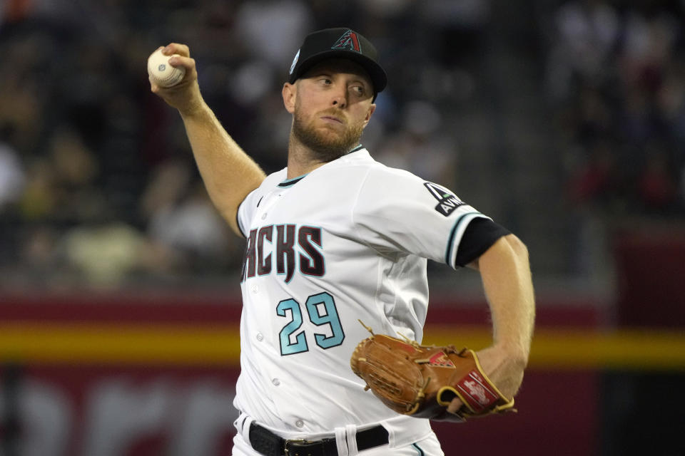 Arizona Diamondbacks pitcher Merrill Kelly throws against the Colorado Rockies in the first inning during a baseball game, Monday, Sept. 4, 2023, in Phoenix. (AP Photo/Rick Scuteri)