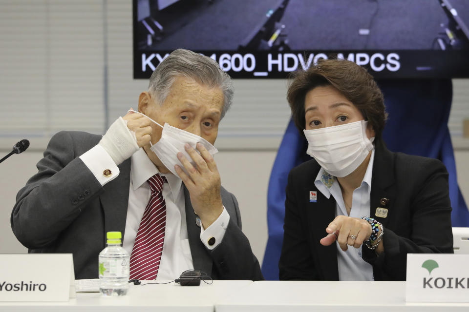 FILE -In this Sept. 24, 2020, file photo, then Tokyo 2020 Organizing Committee President Yoshiro Mori, left, talks with Minister for the Tokyo Olympic and Paralympic Games Seiko Hashimoto after opening remarks session of an on-line meeting focused on how to pull off the delayed Tokyo Games, in Tokyo. Japan's Kyodo news agency, citing a source “familiar with the matter,” said Wednesday, Feb. 17, 2021, a selection committee will ask Hashimoto to become the new president of the Tokyo Olympic organizing committee. Hashimoto, who could be named this week, would replace Mori who was forced to resign last week after he made demeaning comments about women — basically saying they talk too much.(Du Xiaoyi/Pool Photo via AP, File)