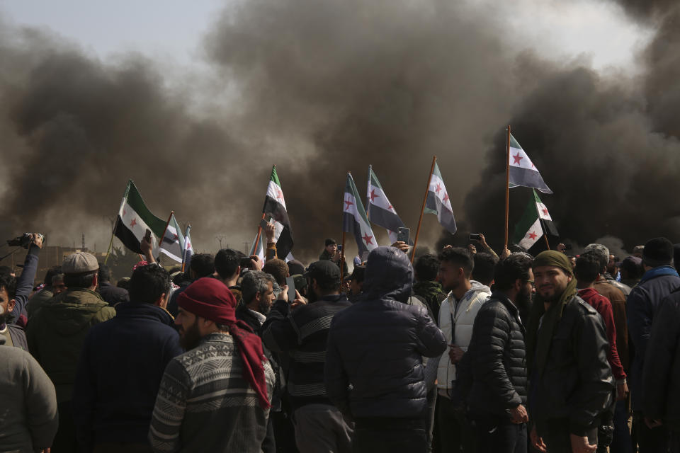 Syrians block main highway in Neyrab, Sunday, March 15, 2020 as they protest agreement on joint Turkish and Russian patrols in northwest Syria. Patrols on the M4 highway, which runs east-west through Idlib province, are part of a cease-fire agreed between Turkey and Russia after an escalation in fighting that saw the Turkish military in direct conflict with Syrian government troops.( AP Photo)