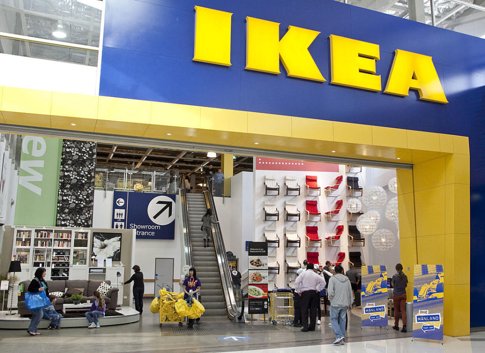 A man walks past a Manland sign in an IKEA store in Sydney.