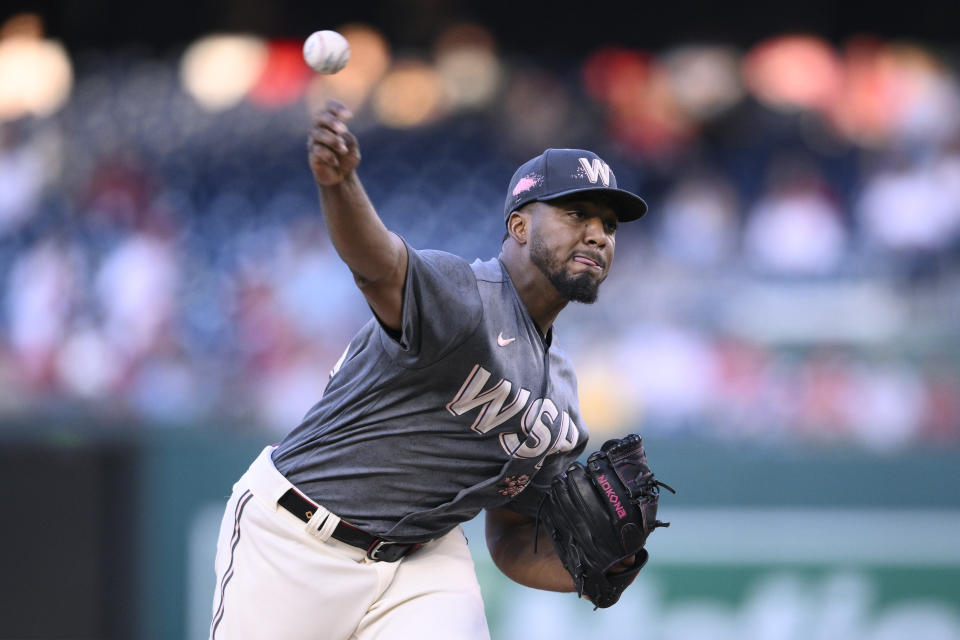 Washington Nationals starting pitcher Joan Adon throws during the first inning of a baseball game against the Philadelphia Phillies, Friday, Aug. 18, 2023, in Washington. (AP Photo/Nick Wass)