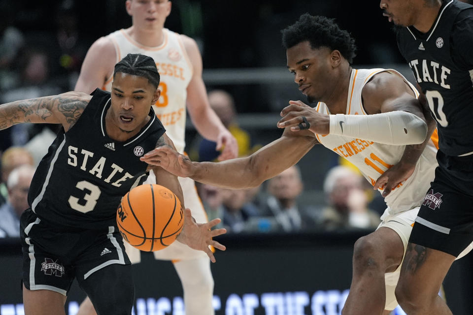 Mississippi State guard Shakeel Moore (3) steals the ball from Tennessee forward Tobe Awaka (11) during the first half of an NCAA college basketball game at the Southeastern Conference tournament Friday, March 15, 2024, in Nashville, Tenn. (AP Photo/John Bazemore)