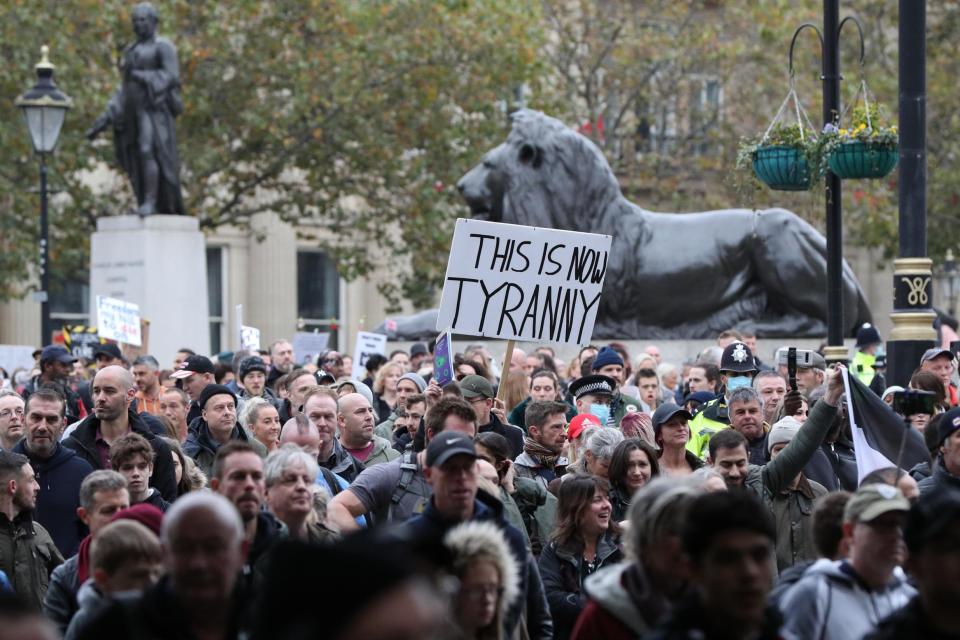 One protester was seen carrying a sign saying 'This is now tyranny' (PA)