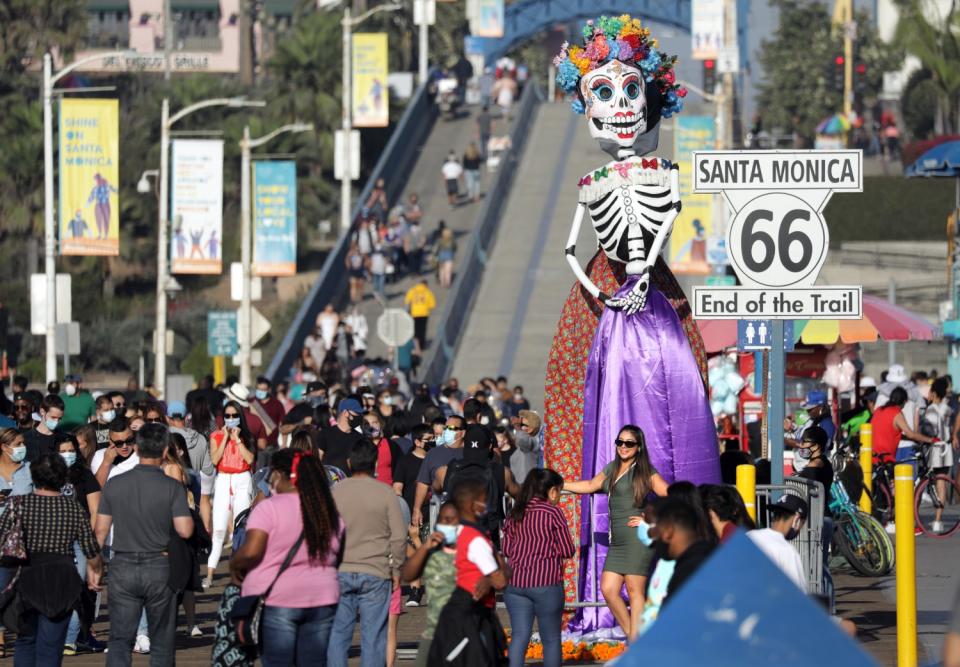 Dia de los Muertos statue greets the crowd at the Santa Monica Pier.