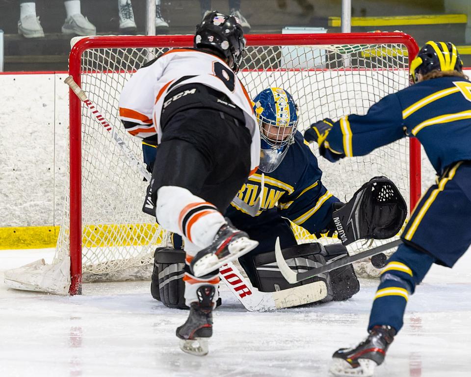 Hartland goalie Kameron Ragon stops a breakaway by Evan Wohlart in a 2-1 victory over Brighton on Saturday, Jan. 15, 2022 at Kensington Valley Ice House.