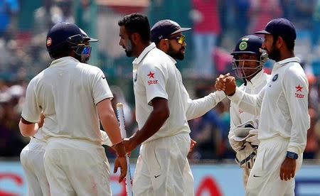 Cricket - India v New Zealand - First Test cricket match - Green Park Stadium, Kanpur - 26/09/2016. India's cricket players celebrate after winning the match. REUTERS/Danish Siddiqui