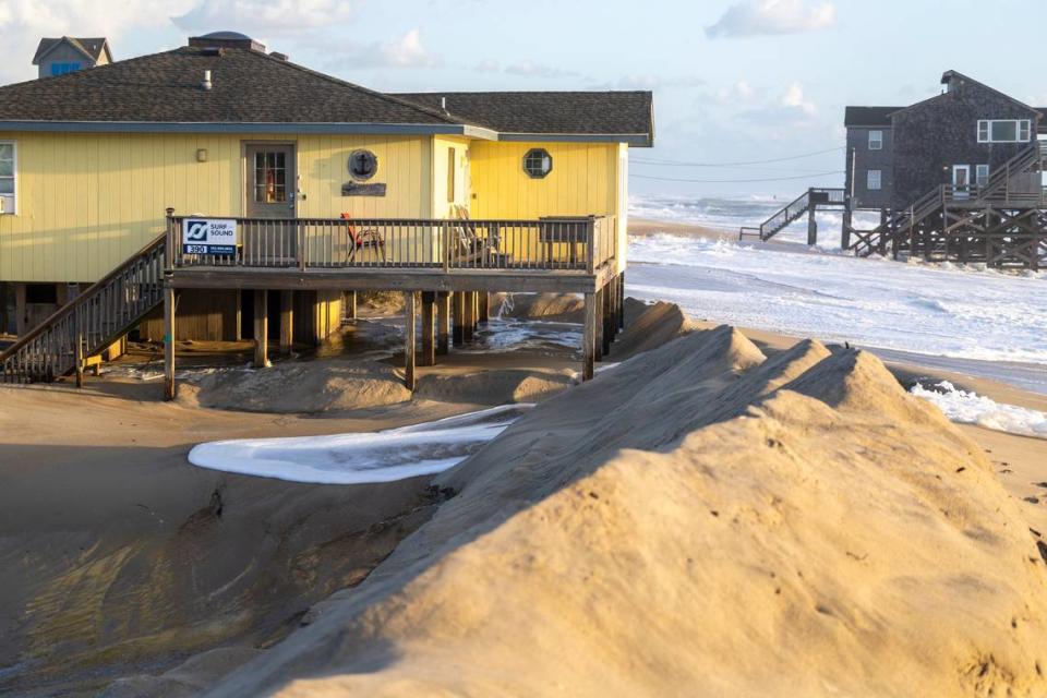 Surf crashes around beach homes in Rodanthe Friday, Sept, 15, 2023 as Hurricane Lee churns in the Atlantic hundreds of miles offshore.