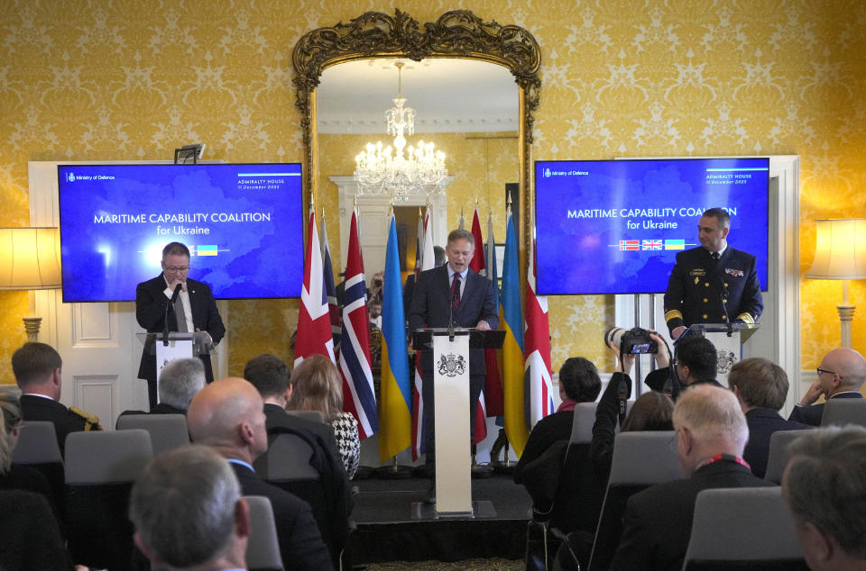 Britain's Defence Secretary Grant Shapps, centre, speaks, during a press conference with Norway's Minister of Defence Bjorn Arild Gram, left, and Vice Admiral Oleksii Neizhpapa of Ukraine, right, in London, Monday, Dec. 11, 2023. Britain's Ministry of Defense is transferring two minehunting ships to Ukraine as part of a package of long-term support to bolster security in the Black Sea. The transfer comes as Britain and Norway announce plans for a new maritime coalition to increase support for Ukraine in the war with Russia. (AP Photo/Kirsty Wigglesworth)