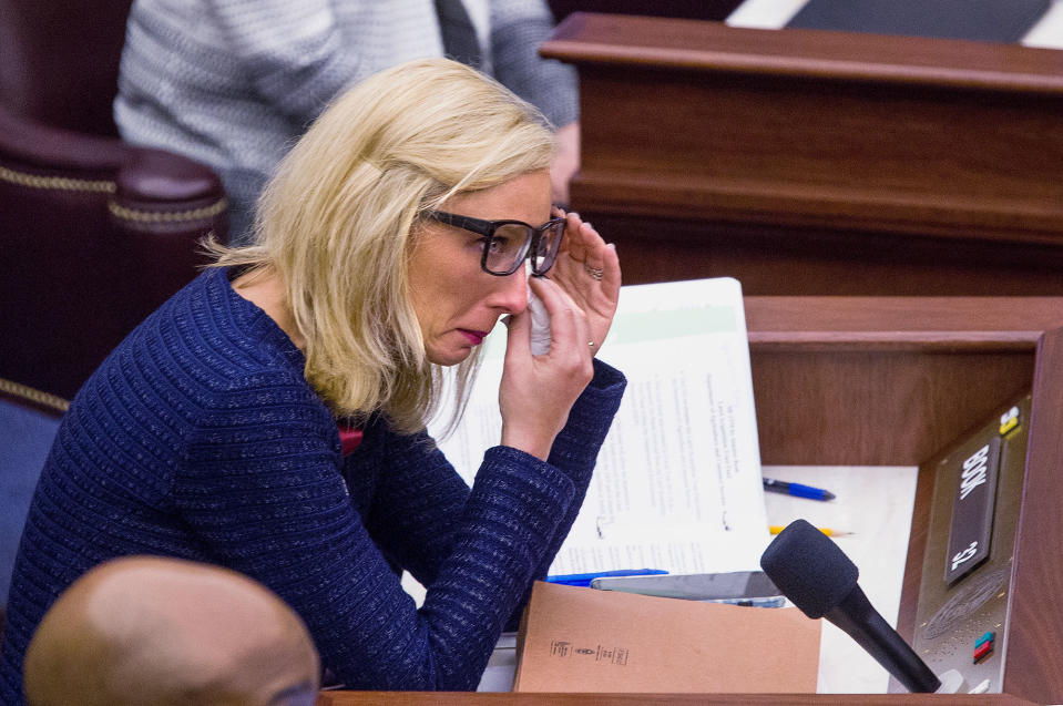 <p>Florida Sen. Lauren Book wipes her eyes after a memorial slide show of the students and teachers that were killed at from Marjory Stoneman Douglas High School during the Senate session the Florida Capitol in Tallahassee, Fla., Feb 21, 2018. The students from Marjory Stoneman Douglas High School are in town to lobby the Florida Legislature after a shooting that left over a dozen dead at their school. (Photo: Mark Wallheiser/AP </p>