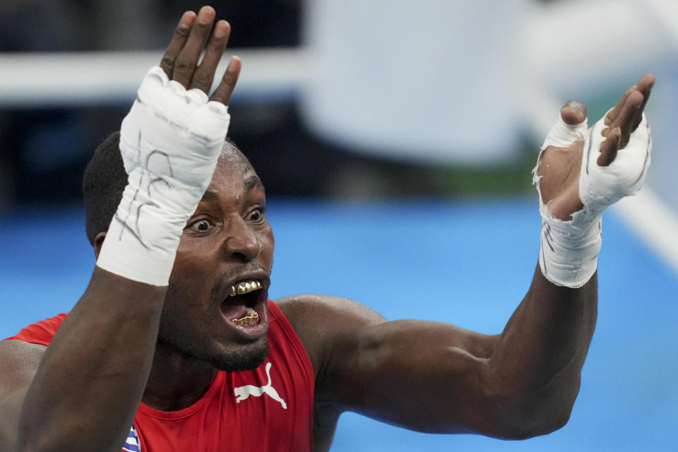 Cuba's Julio La Cruz celebrates defeating Brazil's Keno Machado in the men's boxing 92kg final bout at the Pan American Games in Santiago, Chile, Friday, Oct. 27, 2023. (AP Photo/Dolores Ochoa)