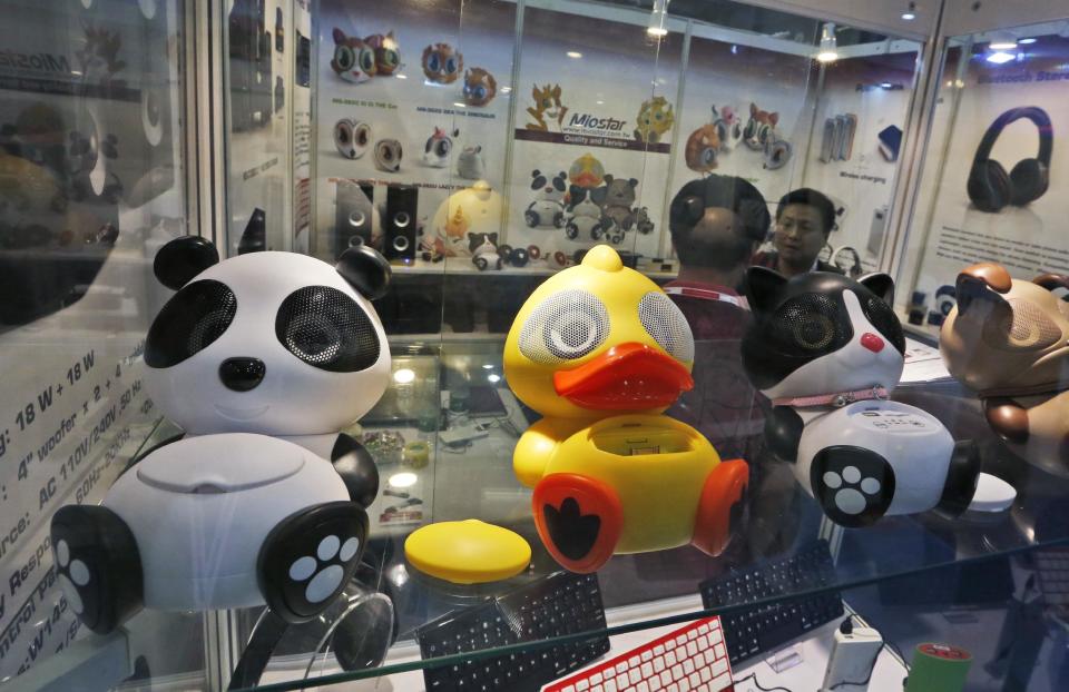 In this April 12, 2014 photo, Chinese made smart phone speakers are displayed in a booth at the Global Sources Spring China Sourcing Fair in Hong Kong. As China's economy downshifts, manufacturers are bracing for the turning point that’s in store for the world’s second biggest economy. (AP Photo/Kin Cheung)