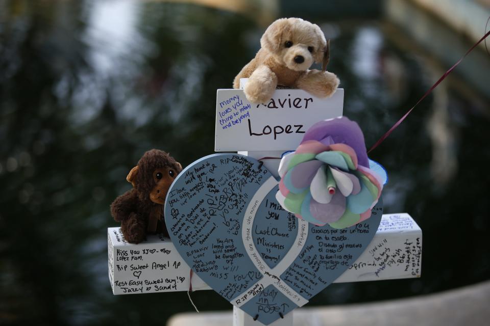 Xavier Lopez's cross stands at a memorial site for the victims killed in the mass shooting at Robb Elementary School in Uvalde, Friday, May 27