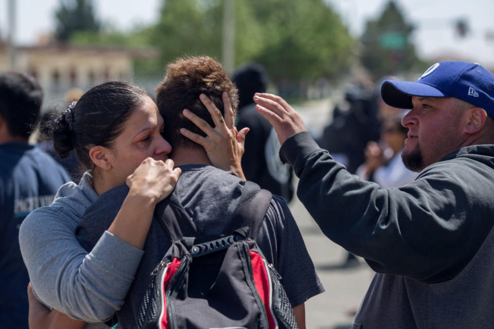 <p>Students are reunited with friends and family after a shooting at Highland High School on May 11, 2018 in Palmdale, California. A 14-year-old male student was taken into custody during a massive law enforcement response following the campus shooting that left one student with a gunshot wound to the arm. (Photo from David McNew/Getty Images) </p>