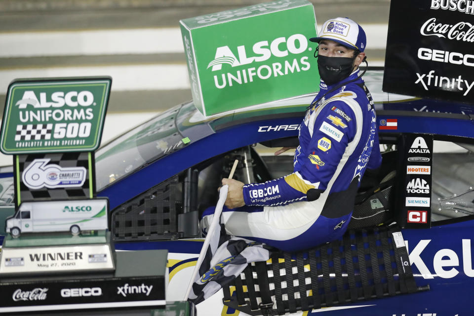 Chase Elliott gets out of his car after winning a NASCAR Cup Series auto race at Charlotte Motor Speedway Thursday, May 28, 2020, in Concord, N.C. (AP Photo/Gerry Broome)