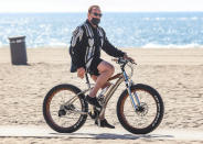 <p>Arnold Schwarzenegger goes for a bike ride through Will Rogers beach on Tuesday in Santa Monica. </p>