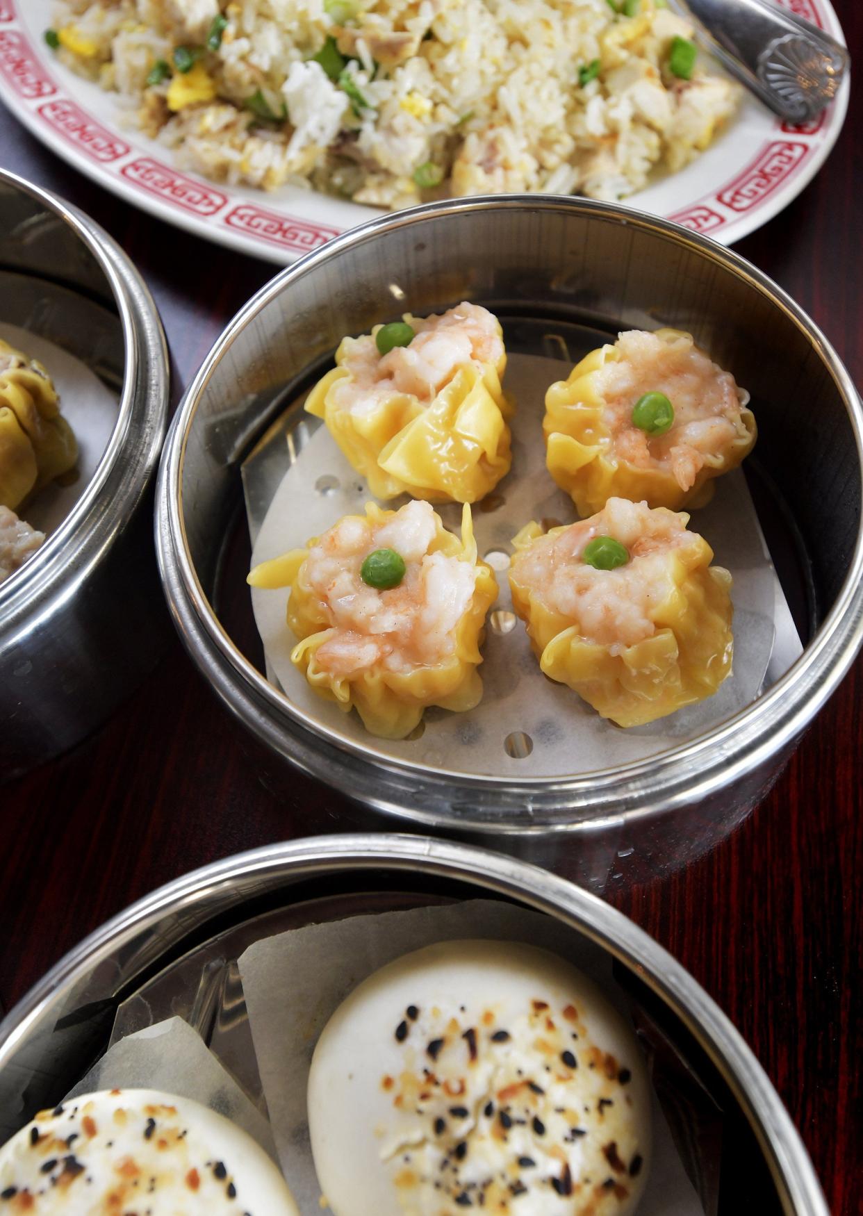 Shrimp shumai dumplings topped with English peas surrounded by other menu offerings Aug. 3 at Lucky Cat, a new dim sum restaurant in Mandarin. Lucky Cat Dim Sum is preparing for its Aug. 8 soft opening at 10550 Old St. Augustine Road, Unit 28.