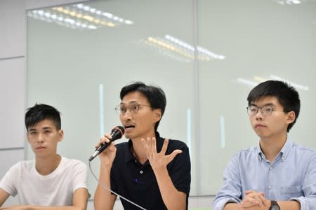 Pro-democracy activists Lester Shum, Eddie Chu and Joshua Wong attend a news conference in Taipei